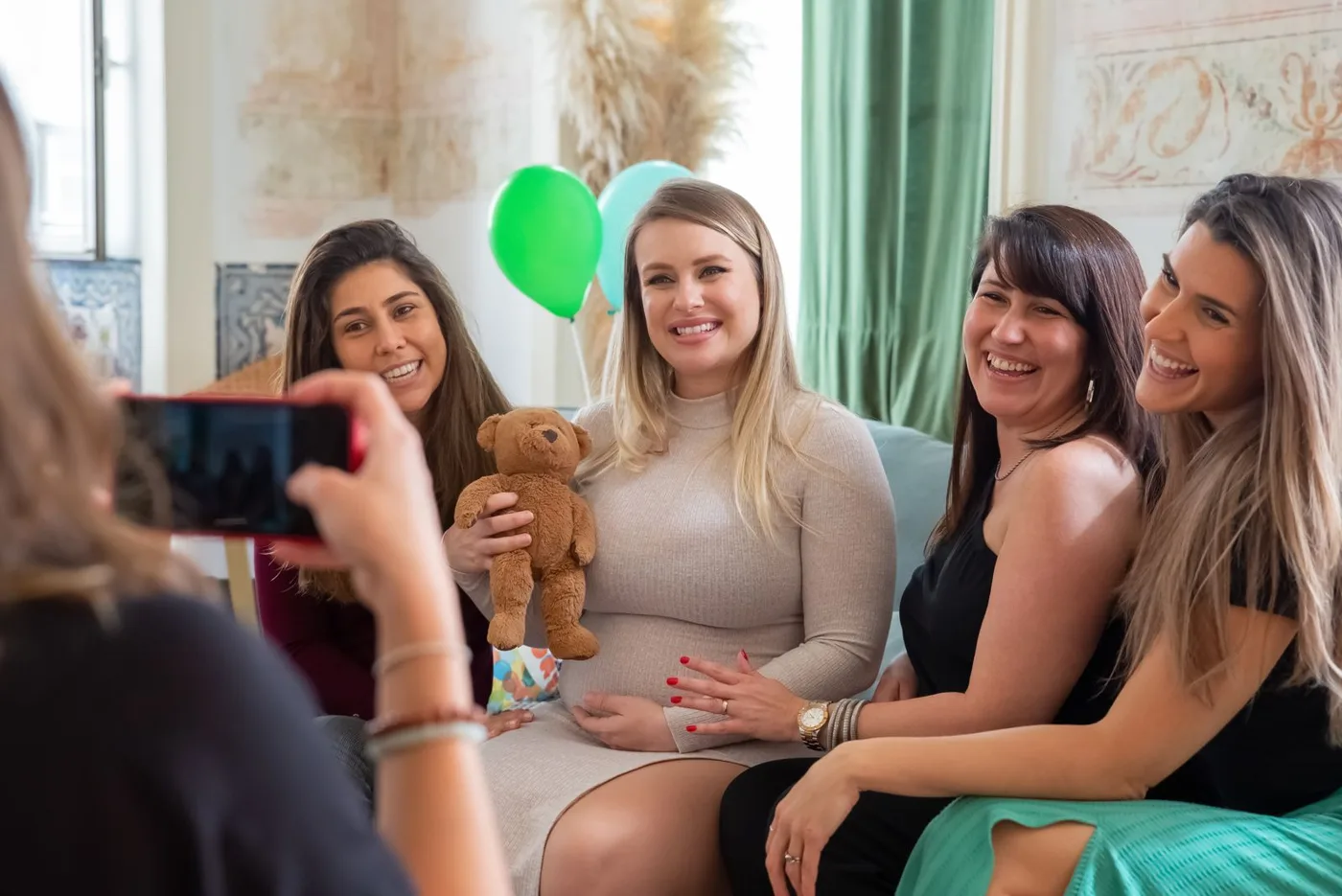 Friends laughing at a baby shower