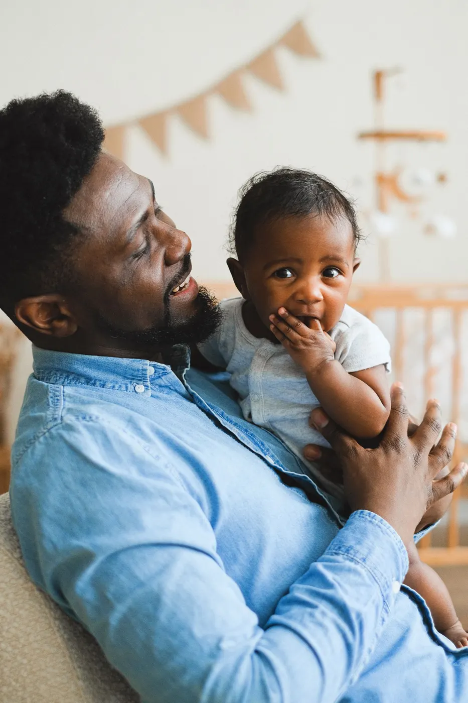 Black father holding his baby