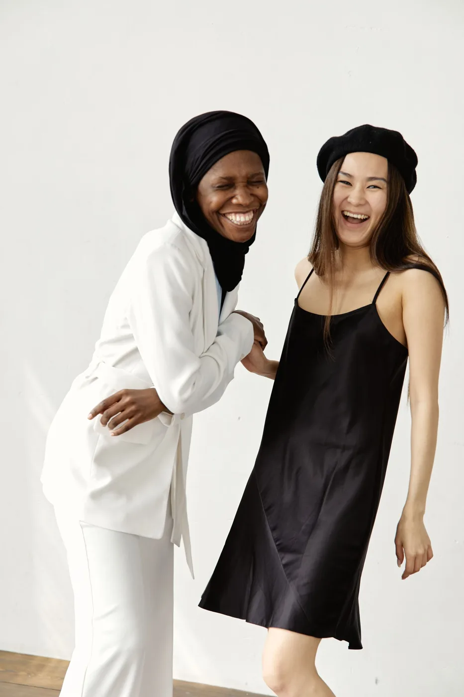 Two friends laughing together