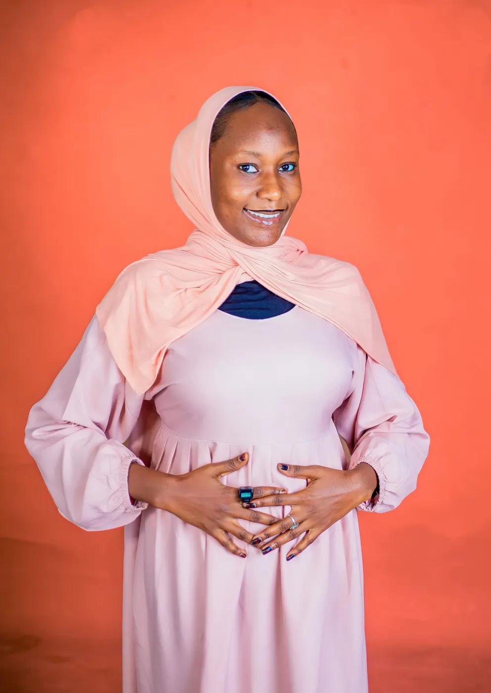Smiling pregnant woman in hijab